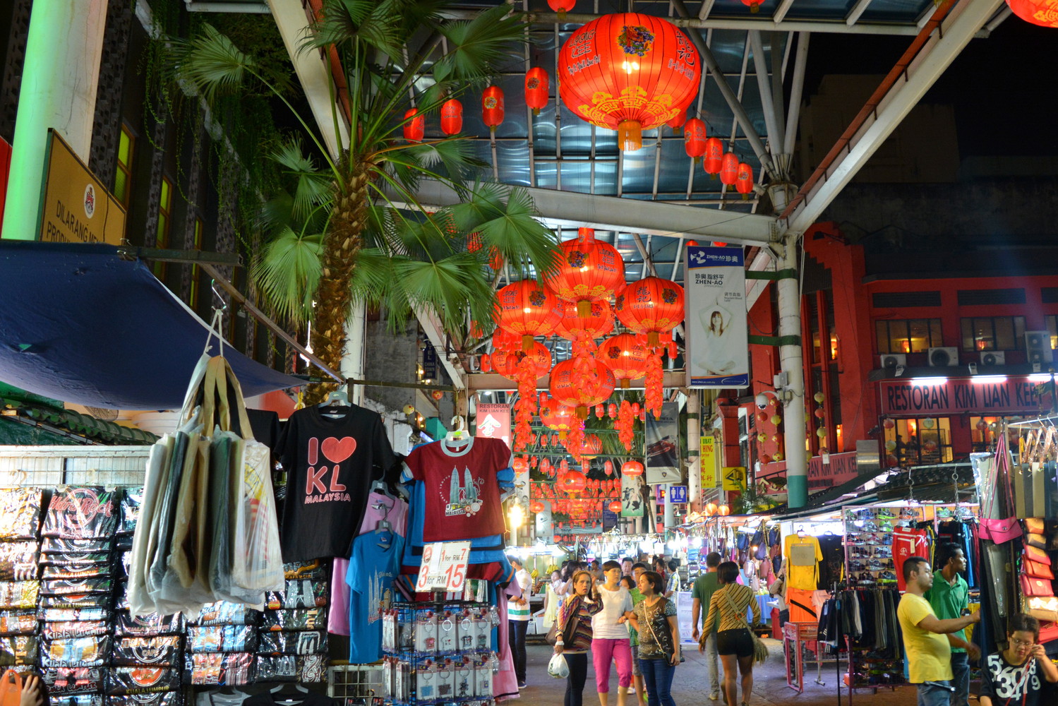 People, shops, chinese style decorative hanging lamps at Petaling street in the night