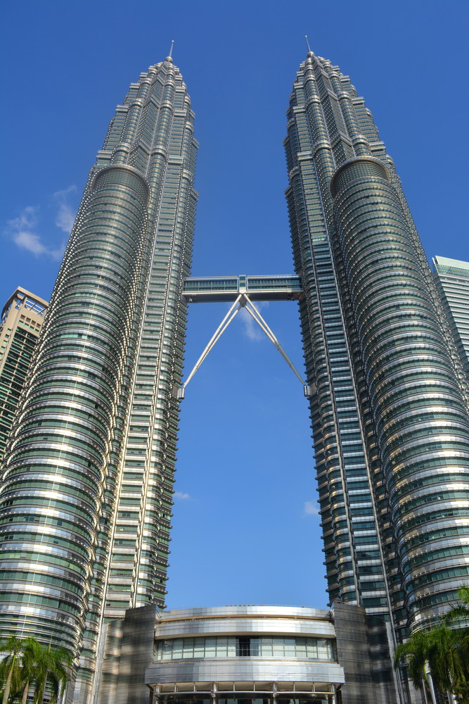 Petronas Twin Towers standing tall, the two towers connected by a bridge