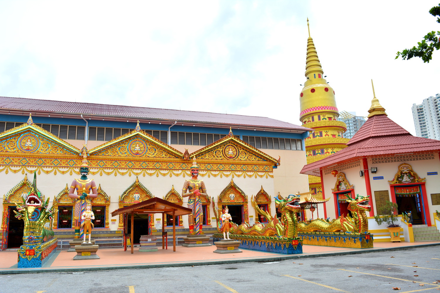 A temple complex with golden spires and statues