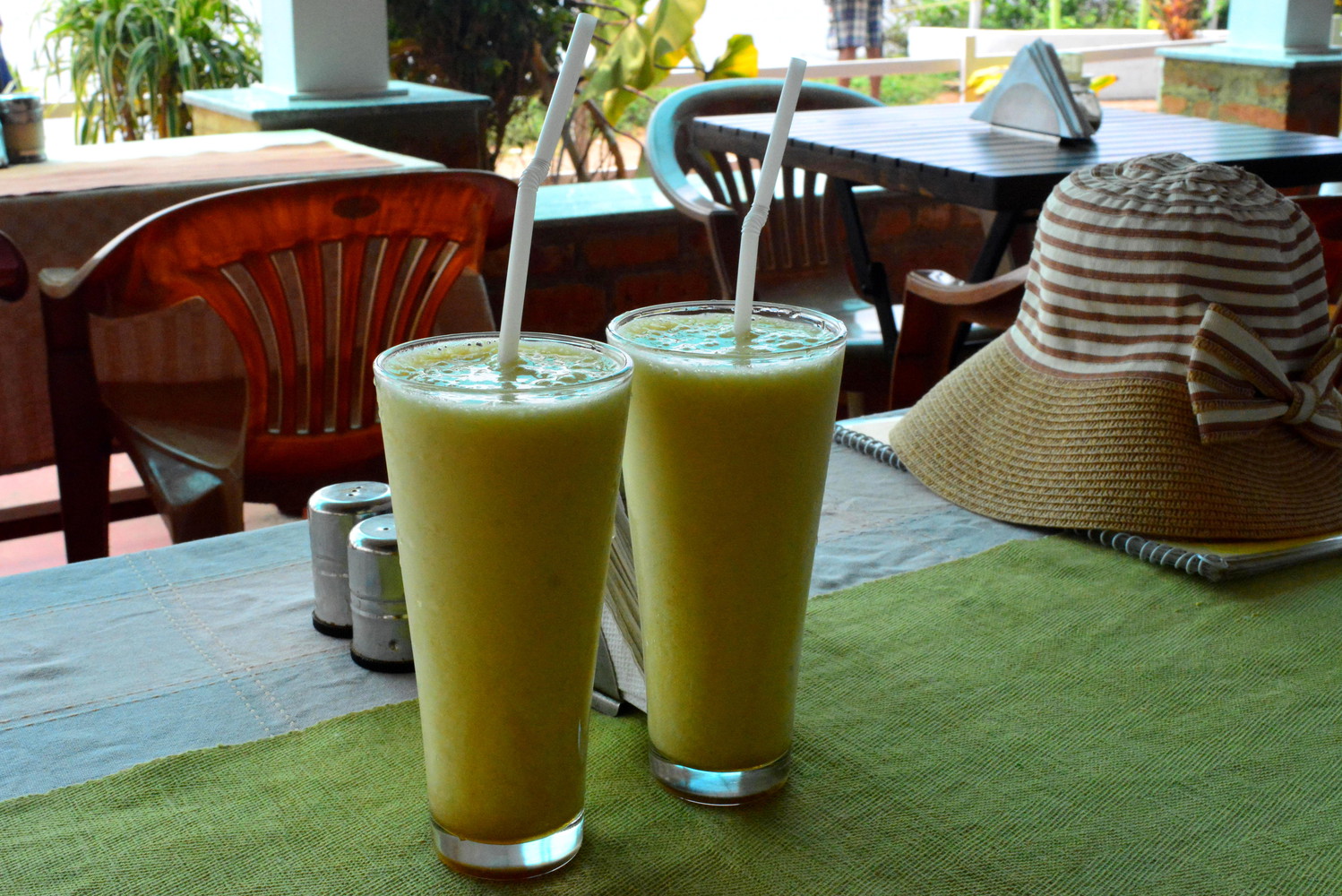 Two glasses of mixed fruit juice known as Banana Boat which is made of banana, pineapple, and honey